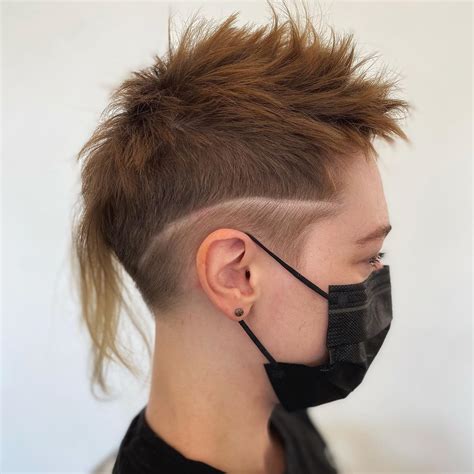 long mohawk hair|simplistic wearing a mohawk.